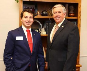 Adam Coffman-Lebanon visiting with Sen. Parson on Wednesday in the State Capitol.